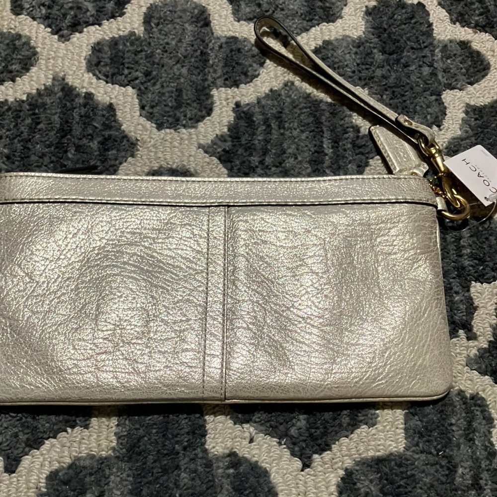 Metallic coach handbag